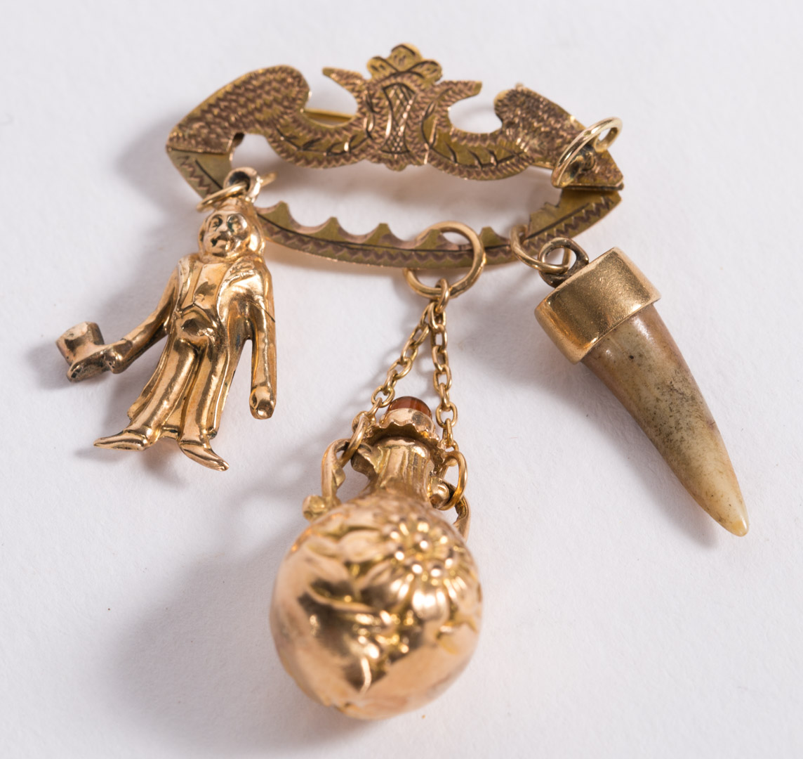 Appraisal: A Venezuelan Charm Brooch kt charm brooch with a perfume