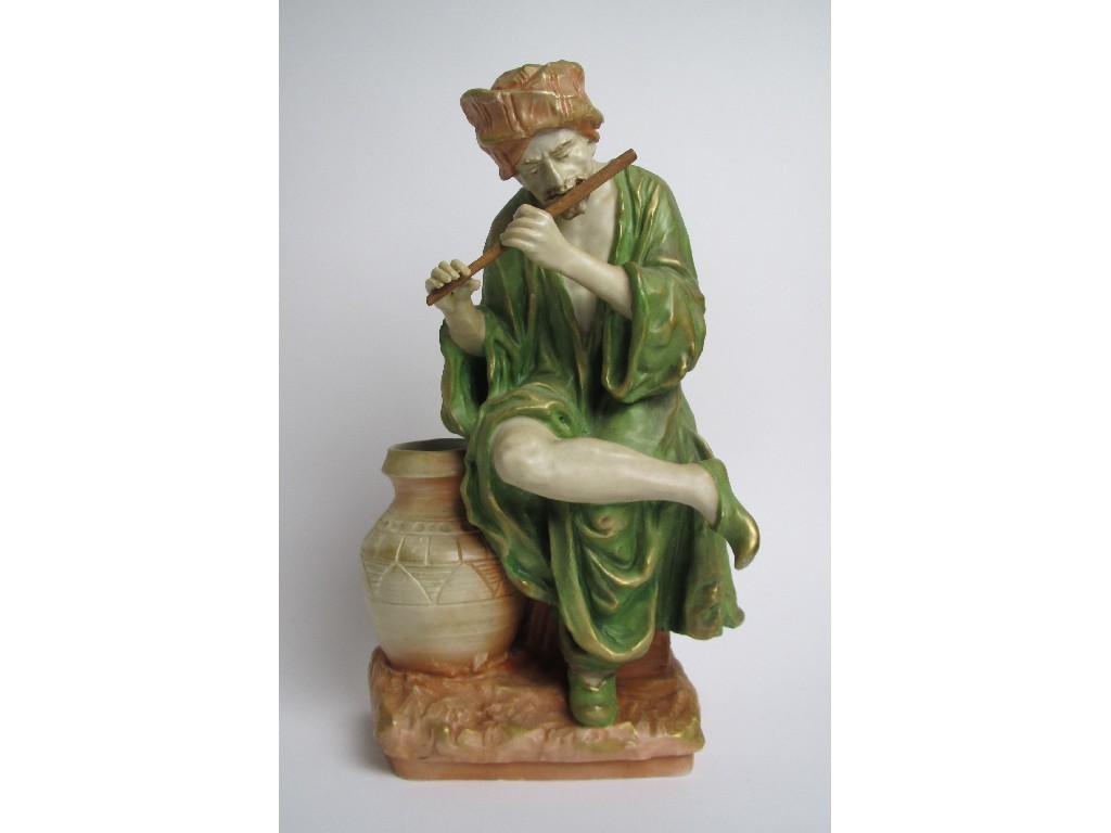 Appraisal: An Amphora porcelain model of a snake charmer seated playing