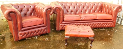 Appraisal: A three piece club style red leather lounge suite comprising