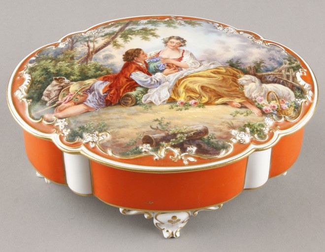 Appraisal: Hand painted porcelain box Lid depicting two figures reclining in