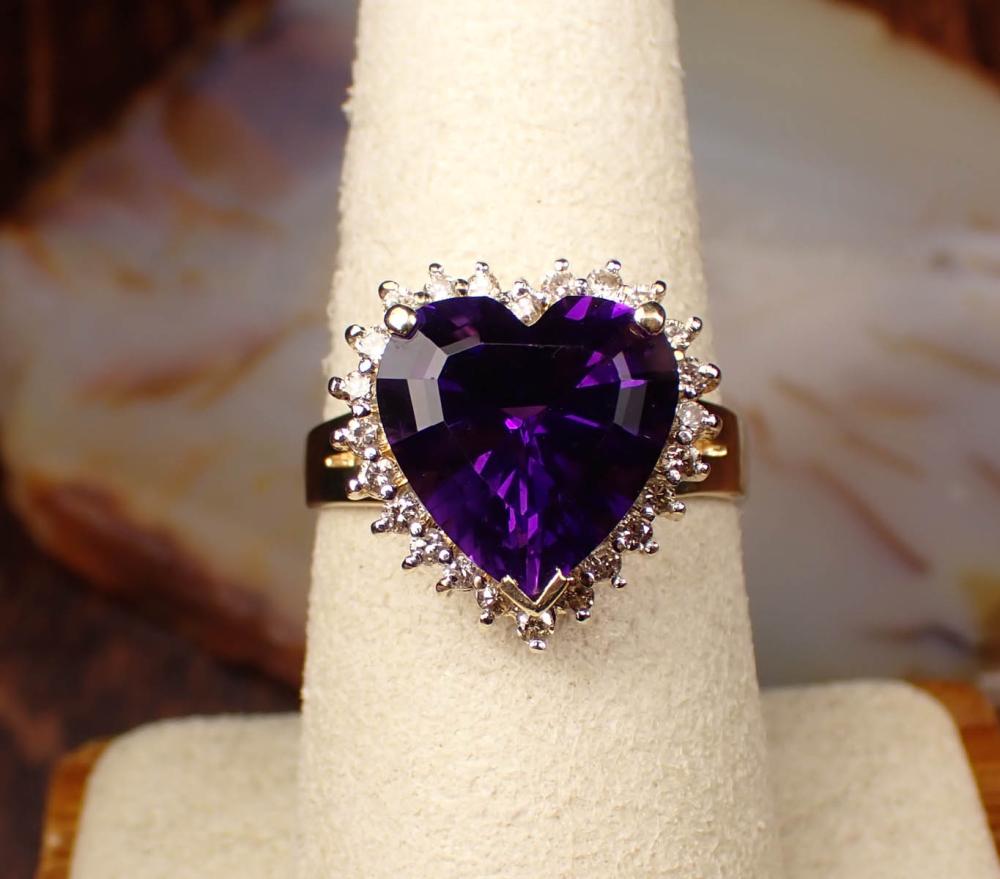 Appraisal: AMETHYST DIAMOND AND FOURTEEN KARAT GOLD RING The yellow gold