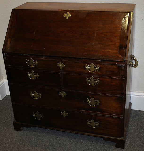 Appraisal: A LARGE TH CENTURY OAK BUREAU with fitted interior fall