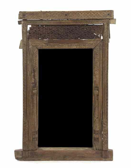 Appraisal: An Indian Temple Window the wood frame having carved geometric