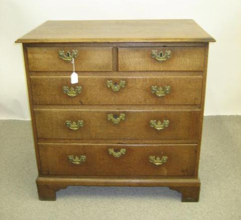 Appraisal: A GEORGE III OAK CHEST c the moulded edged top