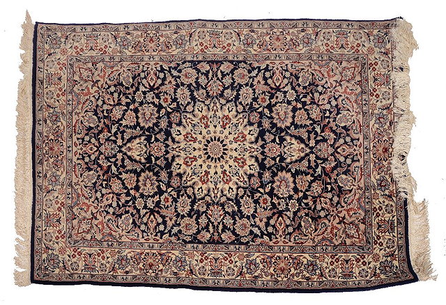 Appraisal: A PERSIAN PATTERN BLUE GROUND RUG with a central star