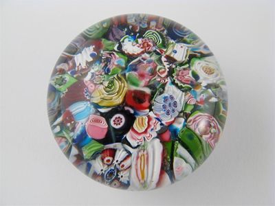 Appraisal: A Clichy scramble paperweight the jumble of canes including pink