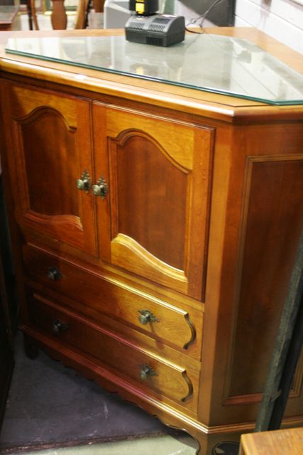 Appraisal: A Louis XV style stained beech corner cabinet th century