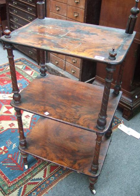 Appraisal: A th century mahogany and walnut three tier whatnot raised