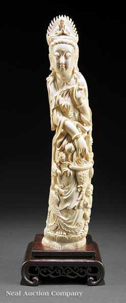 Appraisal: A Chinese Carved Ivory Figure of Guanyin carved on a