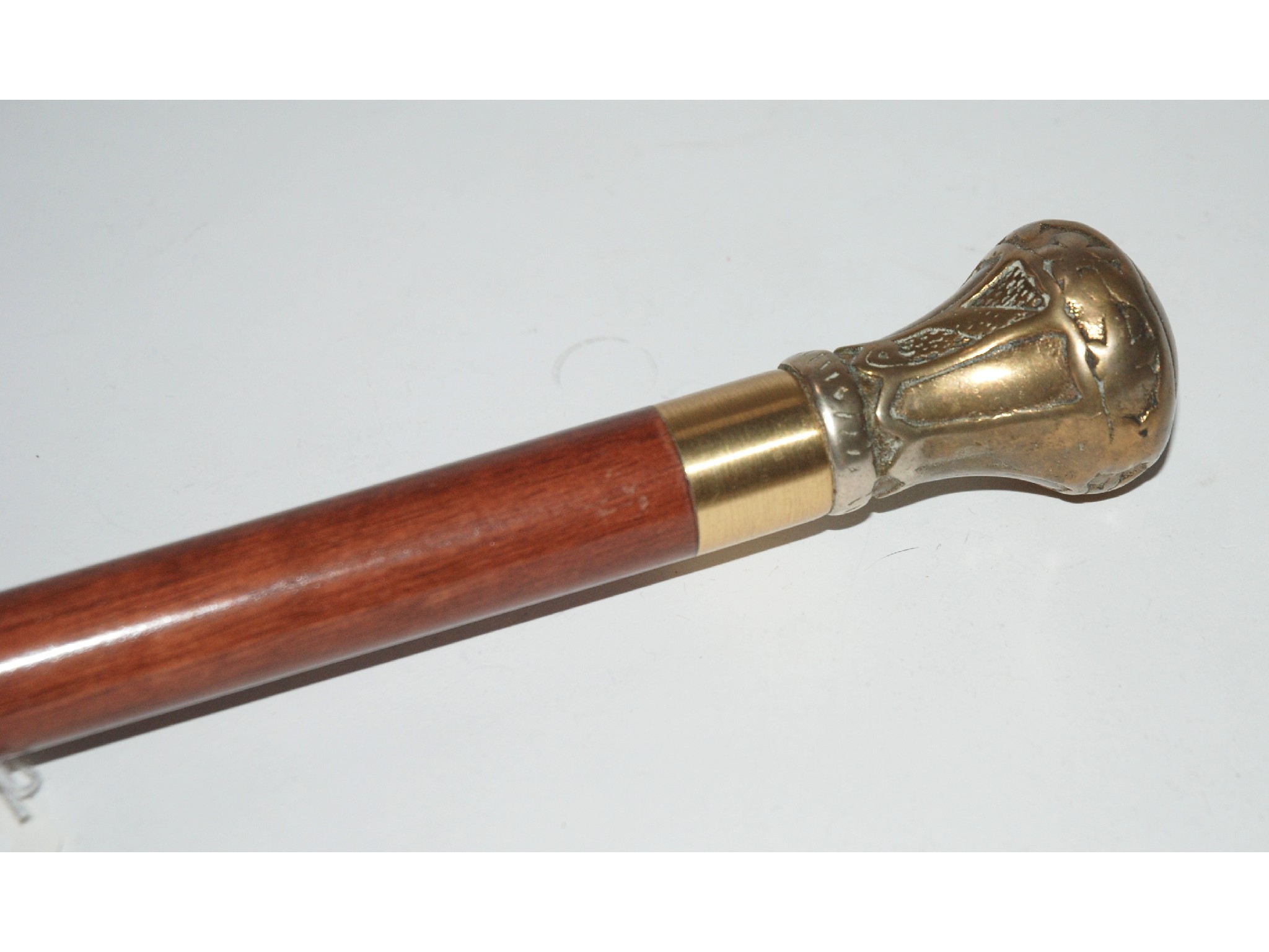 Appraisal: A white-metal mounted walking cane