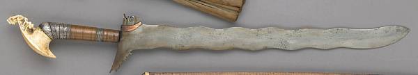 Appraisal: A marine ivory and silver-mounted Moro kerissouthern Philippines probably early