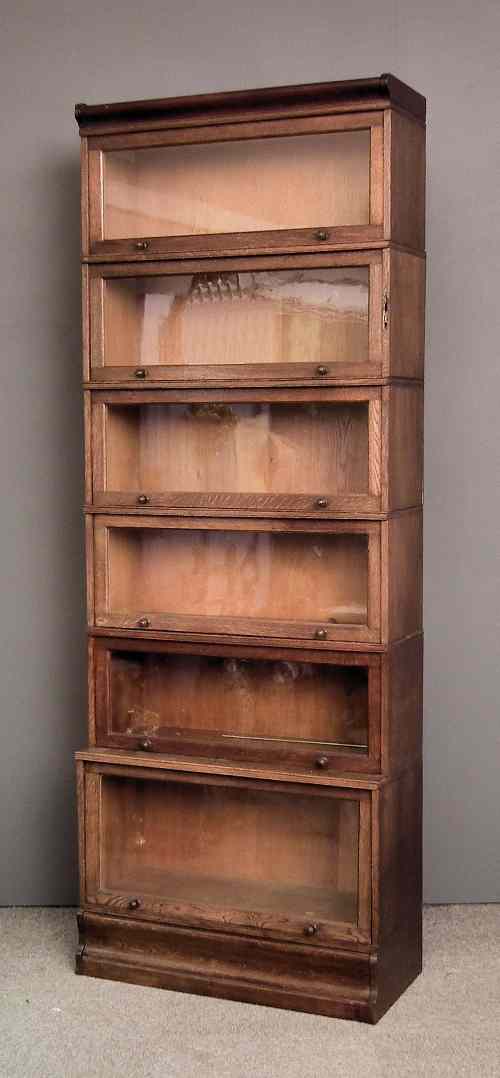 Appraisal: An oak six tier sectional bookcase of Globe Wernicke design