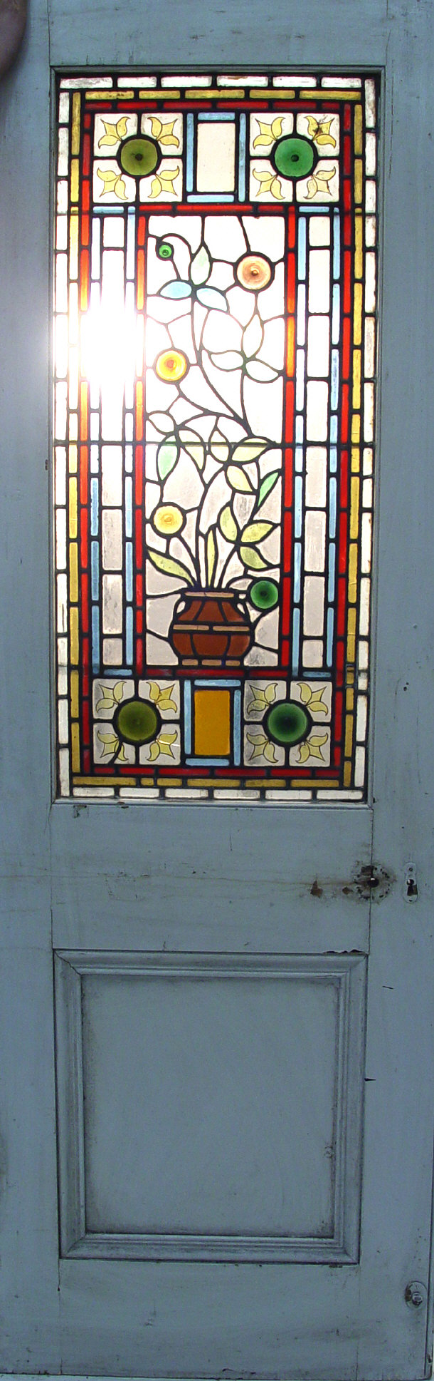 Appraisal: Two wooden doors inset with stained glass panels depicting flowers