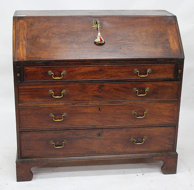 Appraisal: A GEORGE III MAHOGANY BUREAU with fitted interior fall front