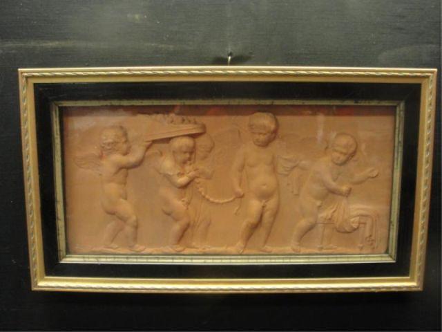 Appraisal: Framed Terracotta Relief of Cherubs Dimensions x