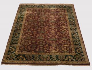 Appraisal: Hand knotted Indo-Persian wool rug having an allover floral field