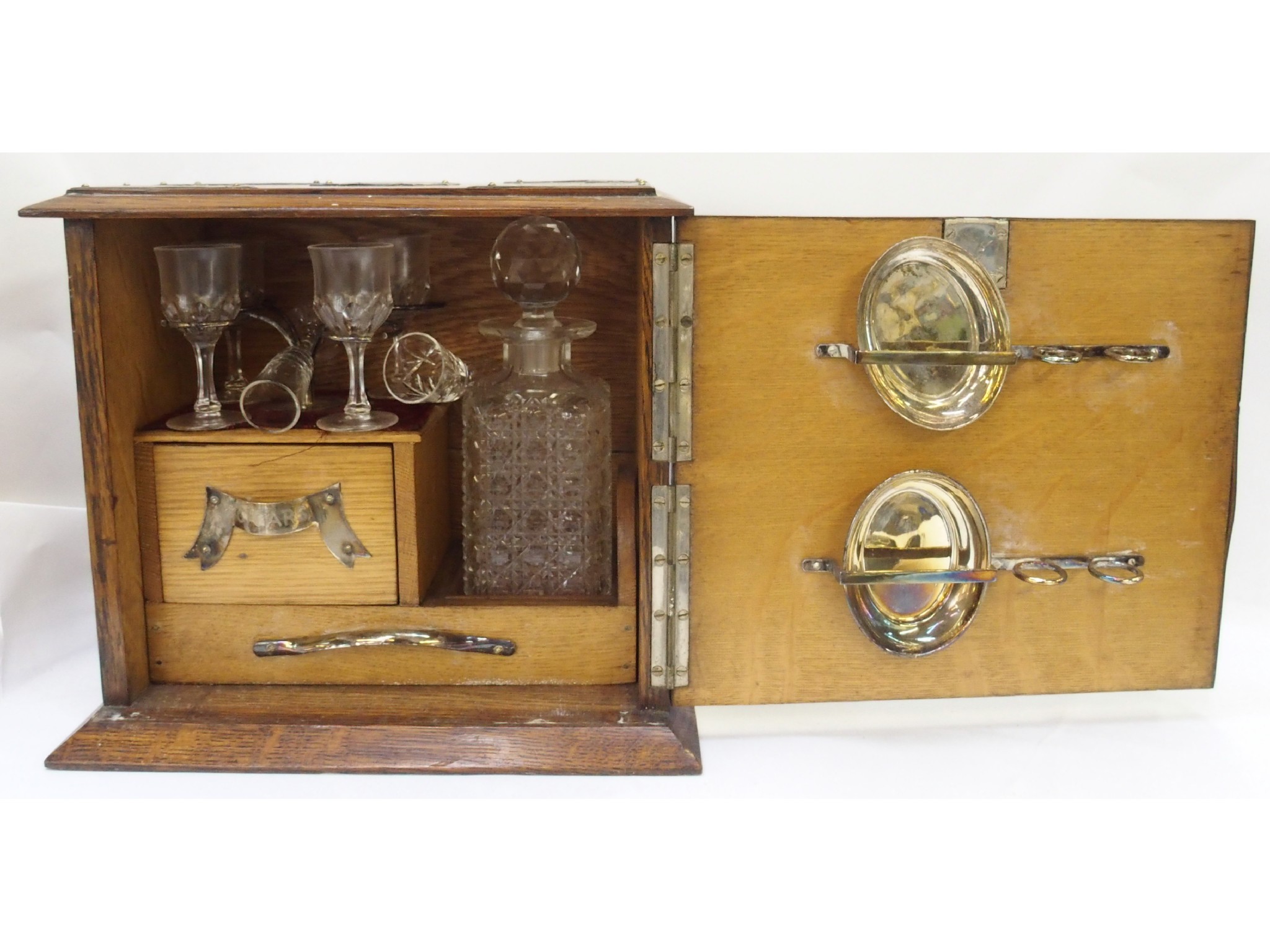 Appraisal: Oak and brass mounted table liquor cabinet fitted with glass