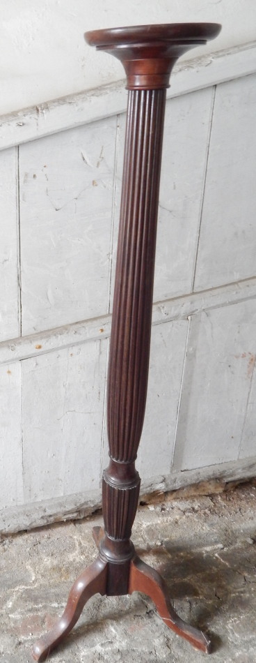 Appraisal: A Victorian mahogany torchere with reeded column