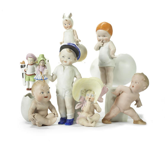 Appraisal: Heubach and other bisque figurines Action baby with vase seated