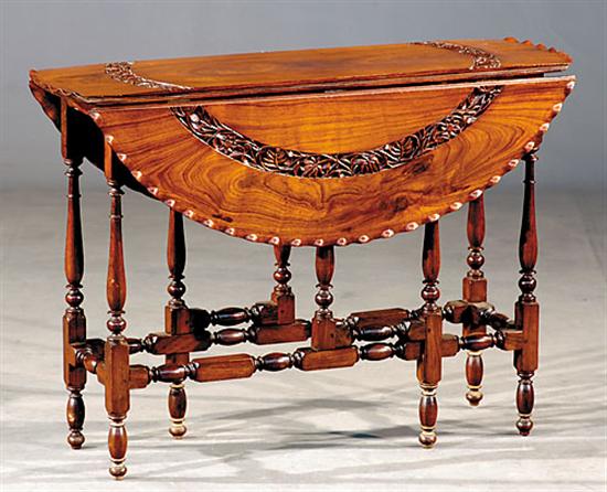 Appraisal: English carved rosewood Sutherland table late th centuryoval form with