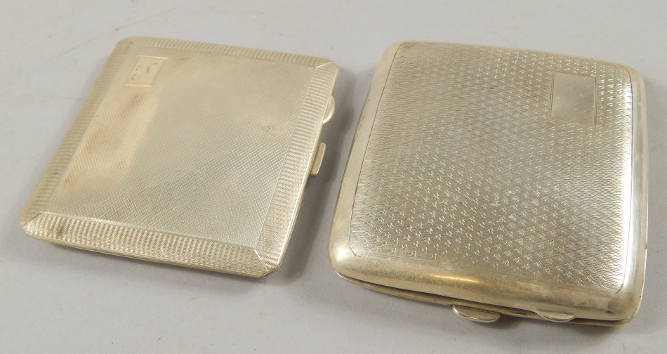 Appraisal: Two engine turned silver cigarette cases one with a simulated