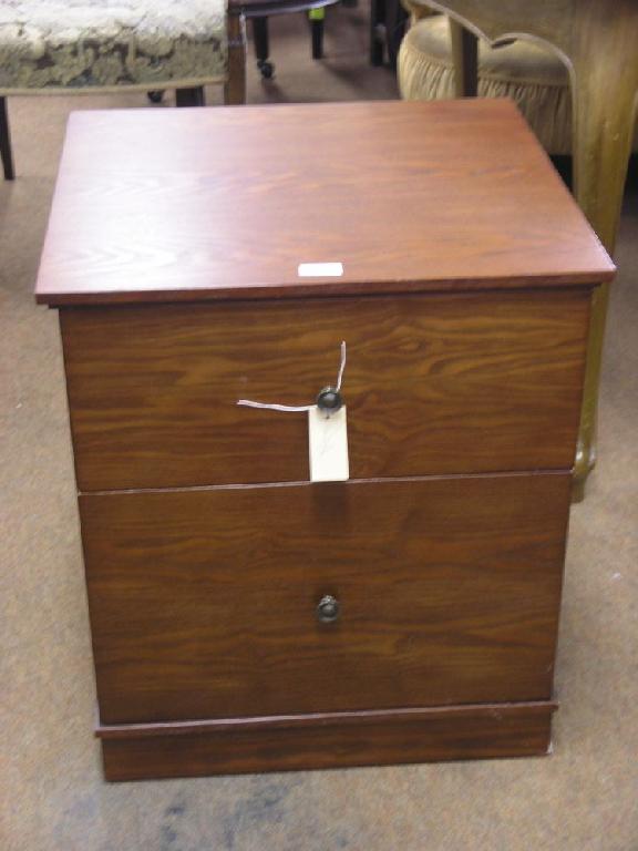 Appraisal: A modern dark stained oak filing chest of two short