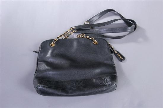 Appraisal: BLACK LEATHER CHANEL PURSE Six interlocking C's embroidered around base