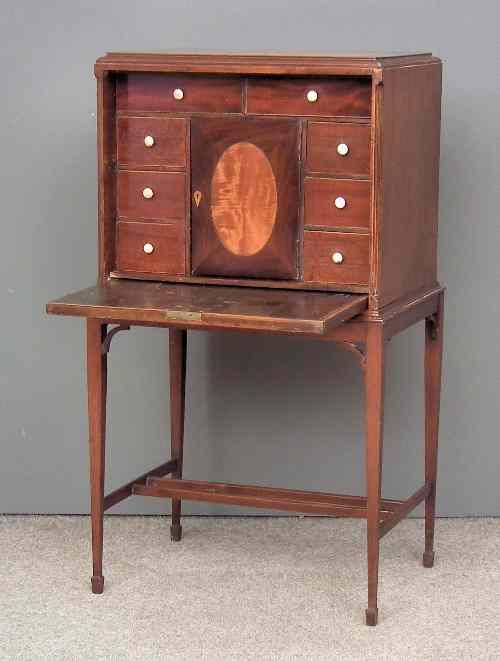 Appraisal: An th Century mahogany rectangular cabinet on later stand the