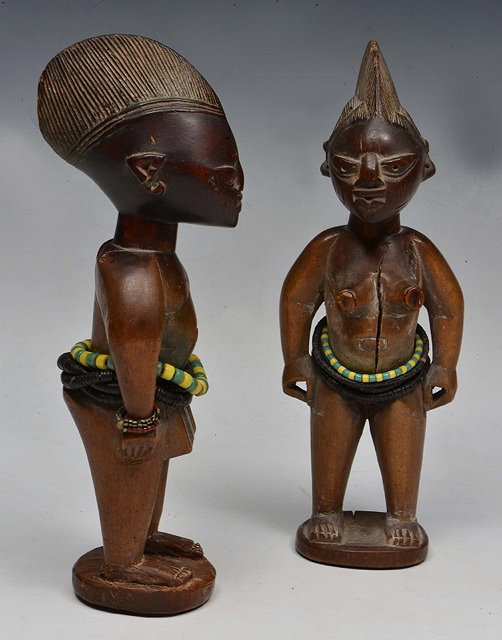 Appraisal: A PAIR OF YORUBA IBEJI FIGURES carved wood with bead