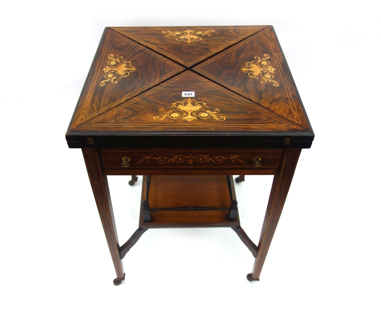 Appraisal: A late Victorian rosewood envelope top card table boxwood strung