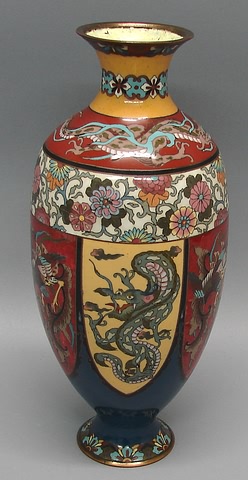 Appraisal: Dragon at shoulder above band of flowers reserves with stylized