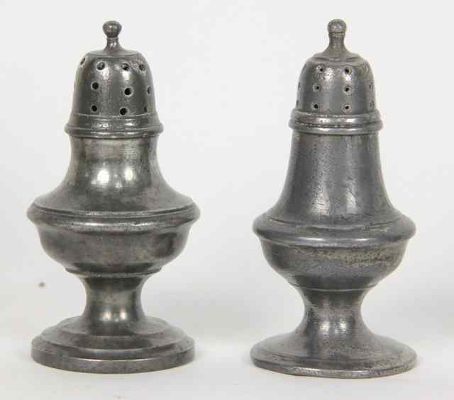 Appraisal: A near pair of pewter pepper pots circa cm high