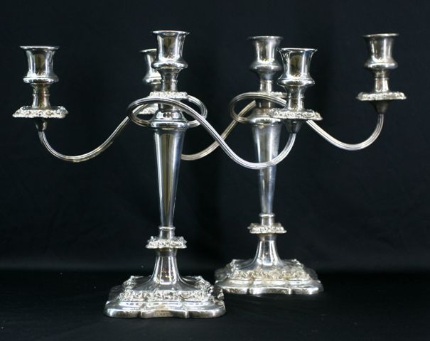 Appraisal: A pair of silver plated three branch candelabra retailed by