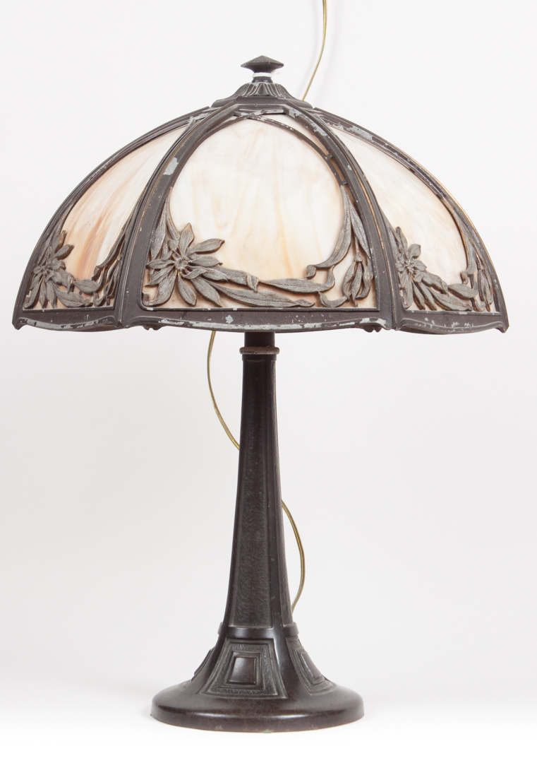 Appraisal: Arts Crafts patinated metal and slag glass lamp first quarter-