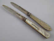 Appraisal: Two Victorian silver fruit knives with m o p handles