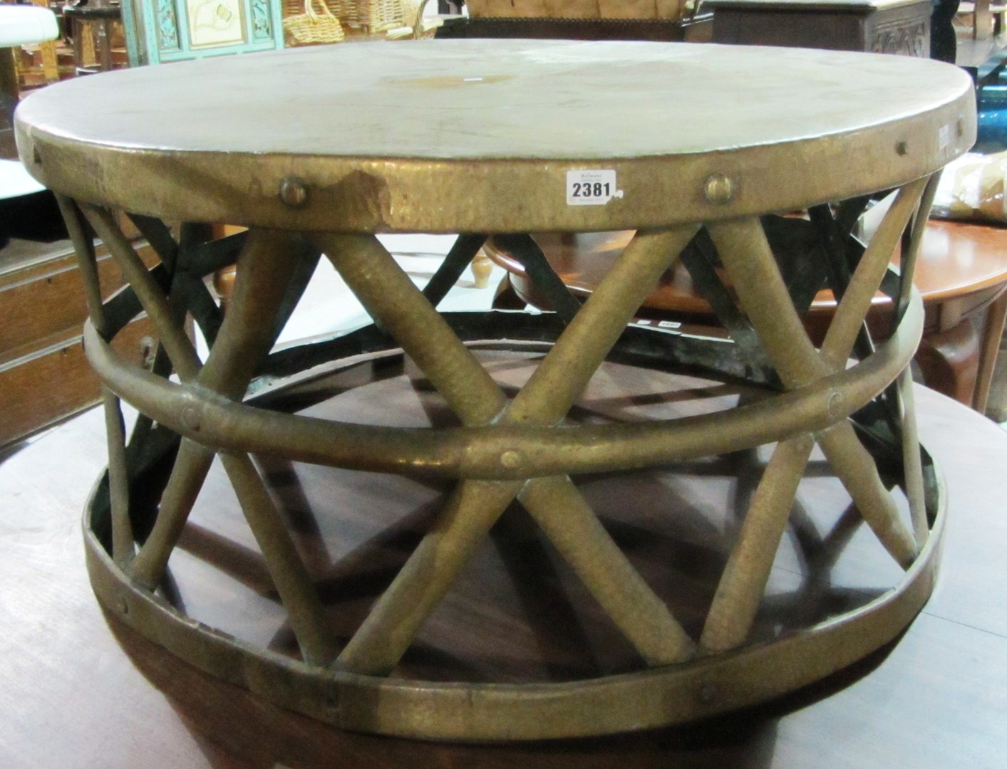 Appraisal: A th century circular hammered brass coffee table