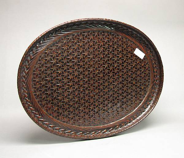 Appraisal: A large lacquered bamboo tray Early th Century The oval