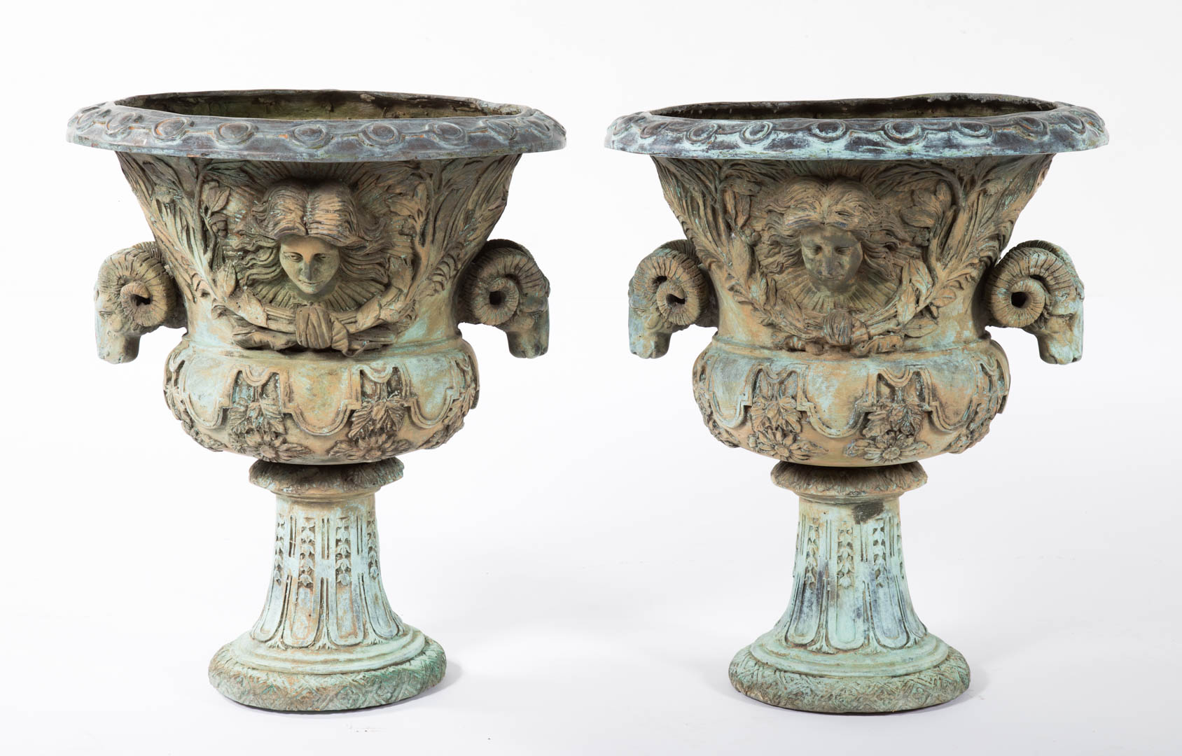 Appraisal: Pair Classical style cast metal garden urns with ram heads