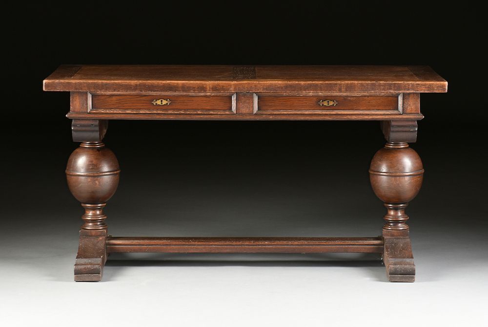 Appraisal: A JACOBEAN STYLE CARVED OAK LIBRARY TABLE EARLY TH CENTURY