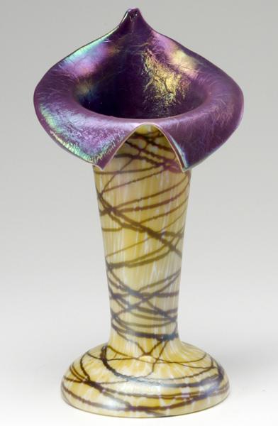 Appraisal: ART GLASS VASE Jack-in-the-pulpit form iridescent vase with aubergine interior