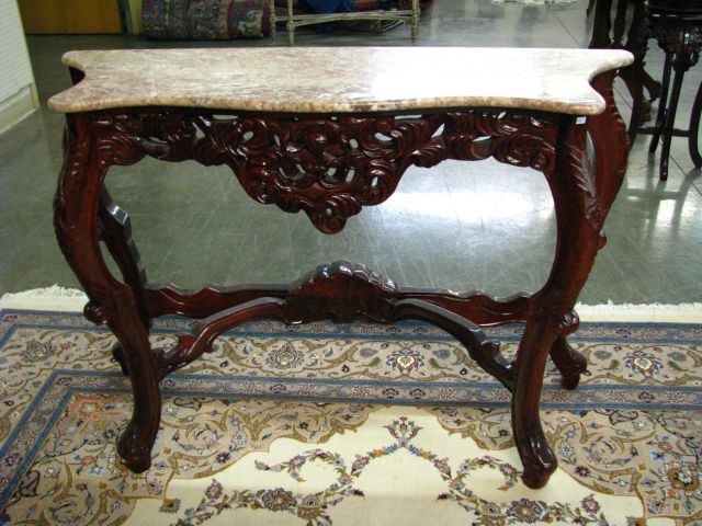 Appraisal: Oriental marble top carved console Indonesian with lacquered wood base