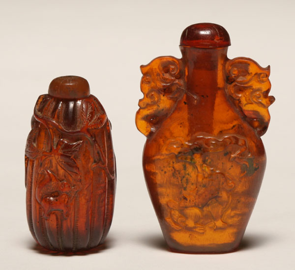 Appraisal: Two Chinese carved amber snuff bottles one of gourd form