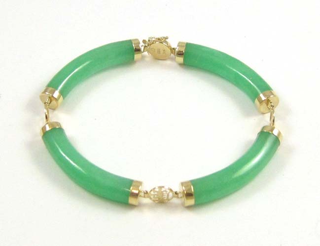 Appraisal: JADE AND FOURTEEN KARAT GOLD BRACELET inches in length with