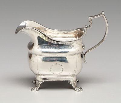 Appraisal: Irish silver creamer rounded rectangular body squared handle paw feet