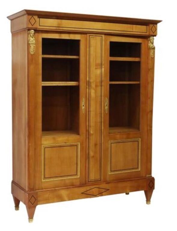 Appraisal: French Directoire style fruitwood bookcase th c molded cornice over