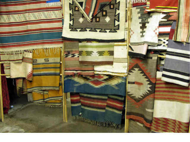 Appraisal: Collection of textiles including Navajo rugs Chimayos and saddle blankets