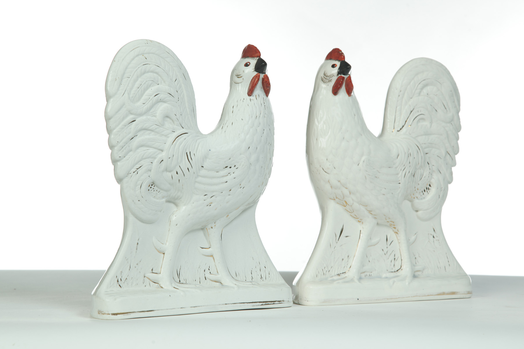 Appraisal: MIRRORED PAIR OF STAFFORDSHIRE CHICKENS England rd quarter- th century