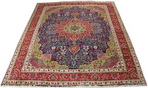 Appraisal: A Tabriz Carpet Bright navy blue centerfield woven with a