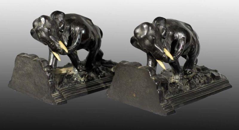 Appraisal: Metal Charging Elephant Bookends Description Pot metal Retains original Ronson