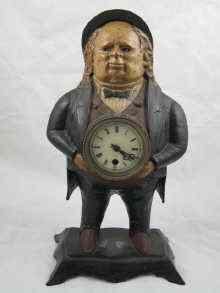 Appraisal: A painted cast iron clock in the form of a